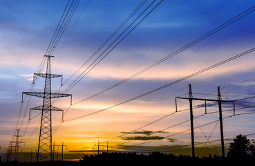 Fototapeta na wymiar Silhouette of high voltage power lines