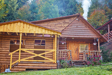 Colorful autumn landscape in the mountain village. Foggy morning in the Carpathian mountains. Ukraine, Europe.