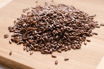 Linseed Flax-seed in Wooden Spoon on the Table.