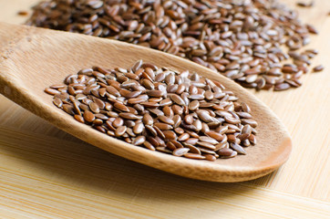 Linseed Flax-seed in Wooden Spoon on the Table.