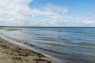 Baltic Sea coastline  with cloudy sky, Latvia.