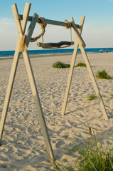 Fototapeta premium Wooden swing on the beach.