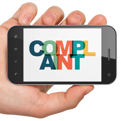 Law concept: Hand Holding Smartphone with Complaint on  display