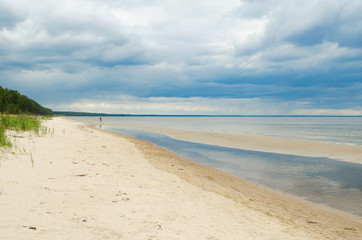 Baltic Sea Beach on Summer Day with Rain Clouds Panorama. Latvia, Gulf of Riga.