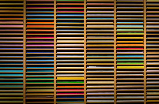 Large shelf of endless selection of color paper at a art store