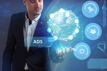 Business, Technology, Internet and network concept. Young businessman working on a virtual screen of the future and sees the inscription: ADS