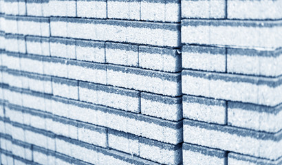 CLOSE UP BLACK AND WHITE IMAGE OF STACKED CONCRETE TILES