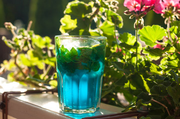 Tradition Summer drink blue mojito with lime mint and ice