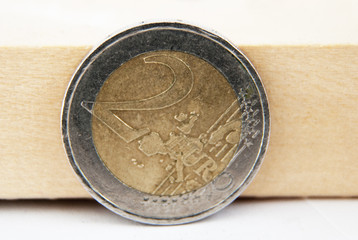  euro coin on  wood