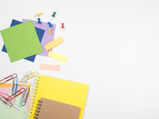 Note all colorful paper with paperclip and notepad, object concept on white background