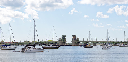 Fototapeta na wymiar Moored sailboats on the Intracoastal Waterway, near the Bridge of Lions, which connects St. Augustine to Anastasia Island, Florida, U.S.A.