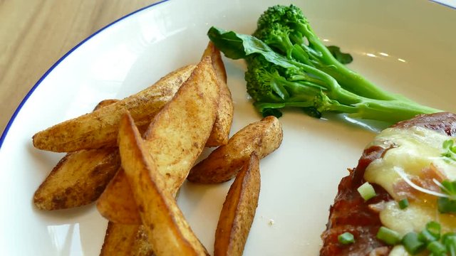 Chicken parmigiana with french fries

