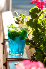 Tradition Summer drink blue mojito with lime mint and ice