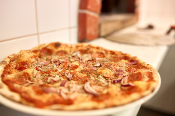 baked pizza at pizzeria