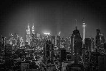 Fototapeta na wymiar Black and white image of Kuala lumpur city skyline at night in Malaysia.