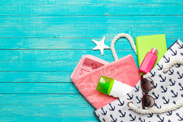 Beach accessories on wooden table.