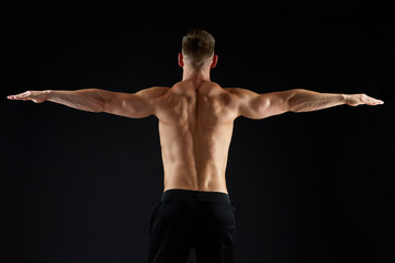 Naklejka premium young man or bodybuilder with bare torso