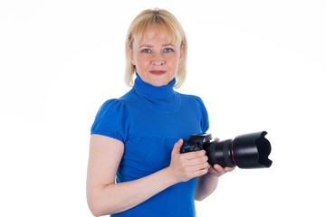 woman is holding a digital camera