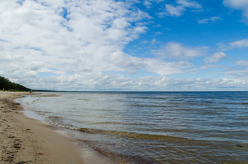  Baltic sea coast under the blue sky and white clouds, Latvia.