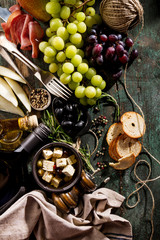 Fototapeta na wymiar Tasty Italian Greek Mediterranean Food Ingredients Top View on Green Old Rustic Table Above