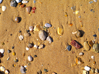 sand and small colorful pebble stones background
