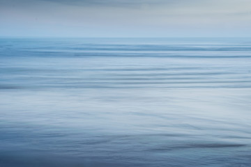 Naklejka premium Blue textured background of sea, sand and sky 