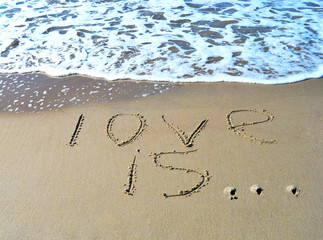 The word love is on the beach background