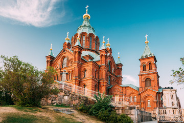 Helsinki, Finland. Uspenski Orthodox Cathedral Upon Hillside On Katajanokka Peninsula Overlooking City - obrazy, fototapety, plakaty