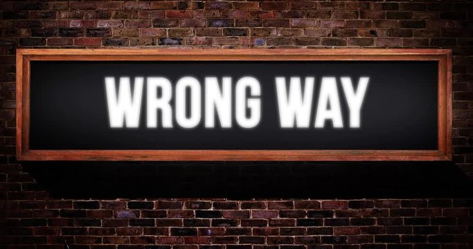 Wrong way sign / on air wooden concept on a brick wall
