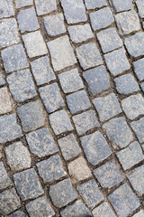 Stone pavement in Prague by day.