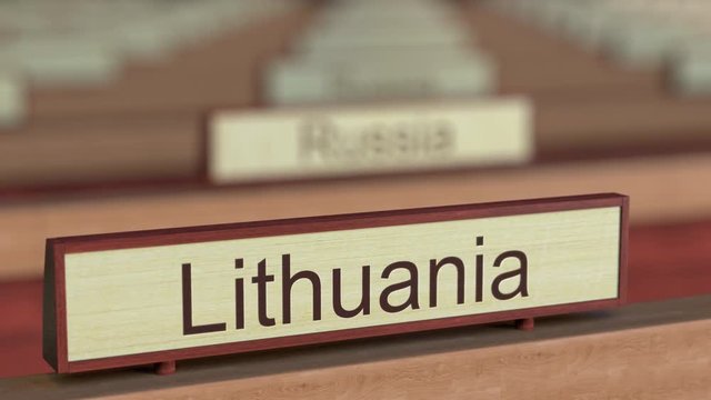 Lithuania name sign among different countries plaques at international organization. 3D rendering