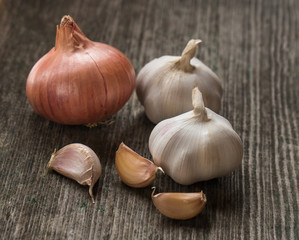 onion and garlic on the old desk