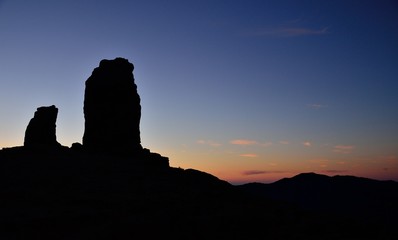 Roque Nublo backlit and the frog with vivid blue sky at sunset, Gran canaria, Canary islands