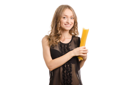 Spaghetti pasta in the hands of a young woman