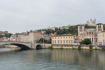 Fototapeta na wymiar Vieux-Lyon, colorful houses and Bonaparte bridge in the center, on the river Saone 