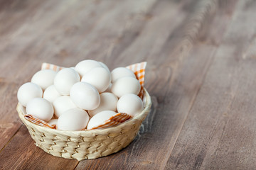 Fresh eggs on wood background. Copy space. Top view