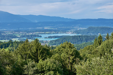 Fototapeta na wymiar Overlooking the city of Villach and Lake Faaker in Austria, from the top of Baumgartnerhoehe in region Kaernten
