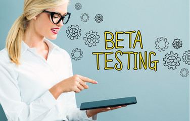 Beta Testing text with business woman using a tablet