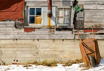 House Wall and a Wheelbarrel