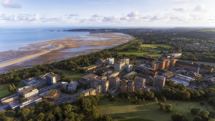 Editorial SWANSEA, UK - AUG 15, 2017: Swansea West, looking towards The Mumbles from Singleton Park, showing the university, Singleton hospital and the bay.