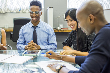 People laughing in business meeting