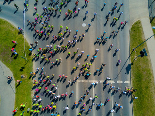Aerial view of people running in the Riga Lattelecom marathon 2017 from the old town down to the...