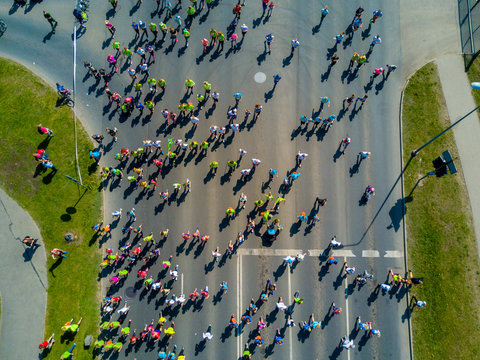 Aerial view of people running in the Riga Lattelecom marathon 2017 from the old town down to the center.