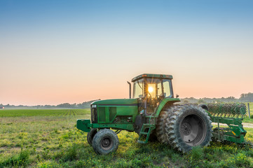 Tractor in a field on a Maryland Farm near sunset