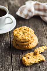 Sweet pistachio cookies and coffee mug.