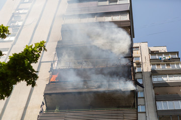 High-rise condominium or apartment burning. Fire in apartments of a large tenement-house.