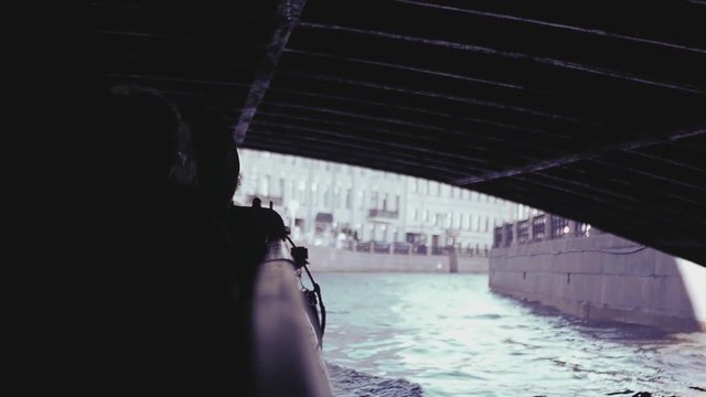 Tourists ride under bridges through the canals of St. Petersburg. slow motion, 1920x1080, full hd