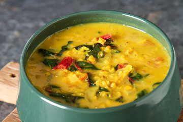 Spicy curry vegetarian food in a bowl. Dark background. Indian food.