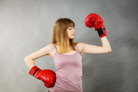 Woman wearing boxing gloves