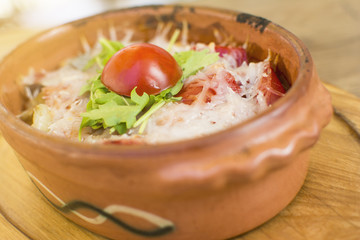 Roasted chicken breast, served with fried potatoes and cooked vegetables. Warm cheese topping with the touch of seasoning. Beautifully served at the restaurant.